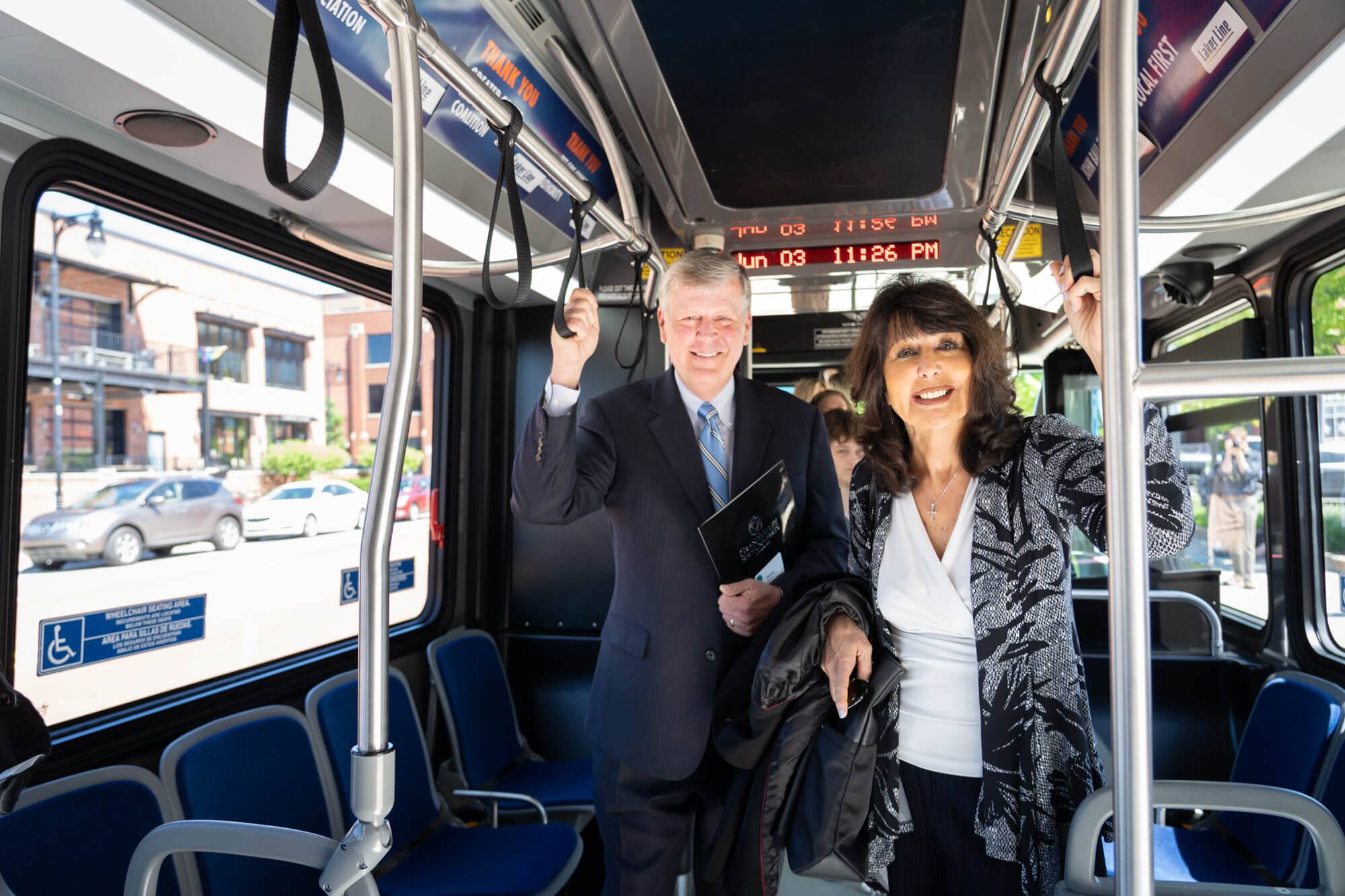President emeritus T. Haas and GVSU President Philomena Mantella in the Laker Line bus.